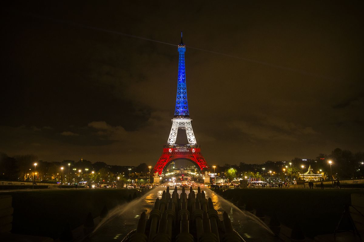 epa05028805 The Eiffel Tower is illuminated in the colors of the French flag in tribute for the victims of the 13 November terror attacks, in Paris, France, 16 November 2015. At least 132 people were killed and some 350 injured in the terror attacks on 13 November, which targeted a concert venue, a sports stadium, and several restaurants and bars in Paris. Authorities believe that three coordinated teams of terrorists armed with rifles and explosive vests carried out the attacks, which the Islamic State (IS) extremist group has claimed responsibility for.  EPA/ETIENNE LAURENT