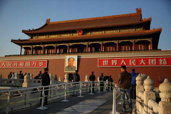 BEIJING, CHINA - NOVEMBER 12: The plainclothes policemen guard in front of Tiananmen Gate outside the Great Hall of the People where the Communist Party's 205-member Central Committee gathered for its third annual plenum on November 12, 2013 in Beijing, China. The 18th Central Committee of the Communist Party of China (CPC) approved a decision on "major issues concerning comprehensively deepening reforms" at the close of the Third Plenary Session of the 18th CPC Central Committee on Tuesday.  (Photo by Feng Li/Getty Images)