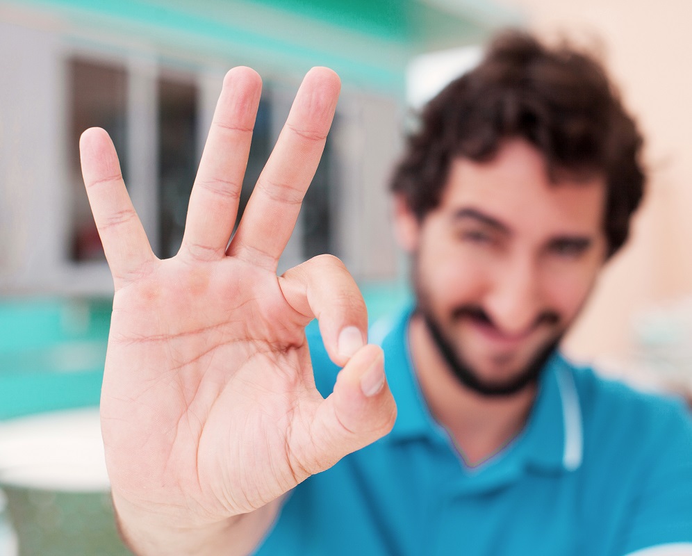 young man okay sign