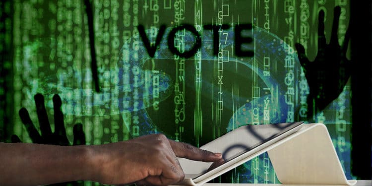 Persona votando en tablet con blockchain y hacker de fondo. Composición por CriptoNoticias. iLexx / elements.envato.com; pixel2013 / Pixabay.com; AnnaStills / elements.envato.com.