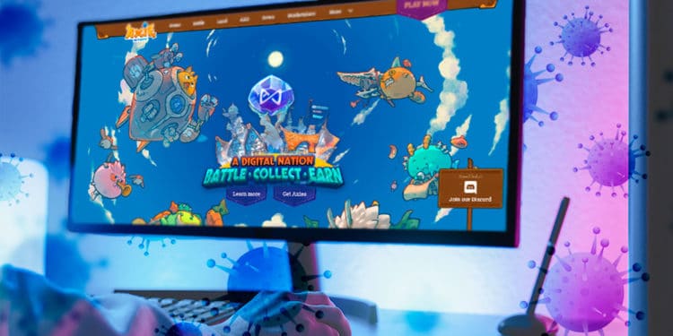 Juego Axie en pantalla y virus de COVID.