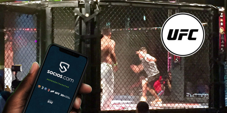 Pelea de UFC con su respectivo token y mano sosteniendo teléfono con pantalla de socios.com.