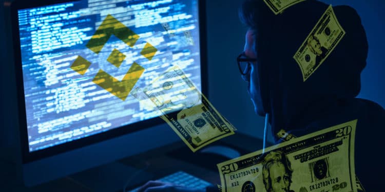 Hacker con logo de Binance y dólares.