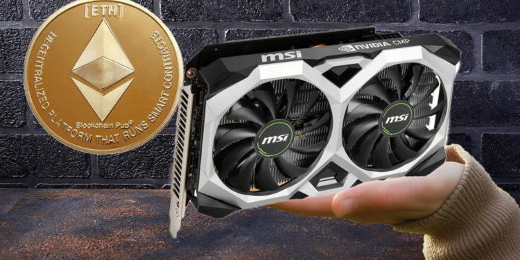 Mano sosteniendo tarjeta de video Nvidia y ether sobre la pared.