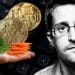 Bitcoins sobre teclado mano sosteniendo zanahorias que representan taproot y retrato de Snowden.