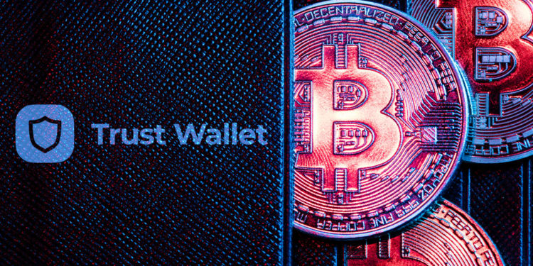 Billetera con bitcoins y logo de Trust Wallet.