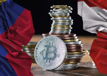 Bitcoin con bandera de Perú y Colombia.