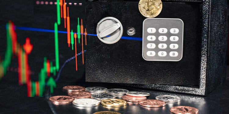 Caja fuerte con bitcoins y gráfico.