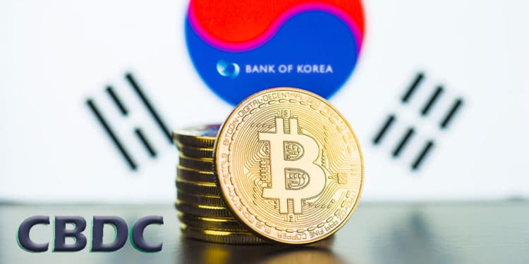 Bitcoins con bandera de Corea del Sur y logo del Bank of Korea, a un lado letras CBDC.