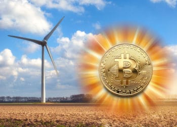 Molino energía eólica y bitcoin resplandeciente.