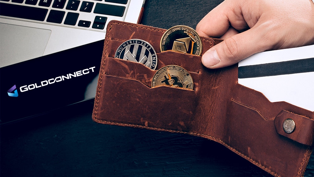 Cartera con criptomonedas y logo de Goldconnect.