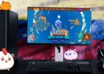 Axies en pantalla y bandera de Venezuela.