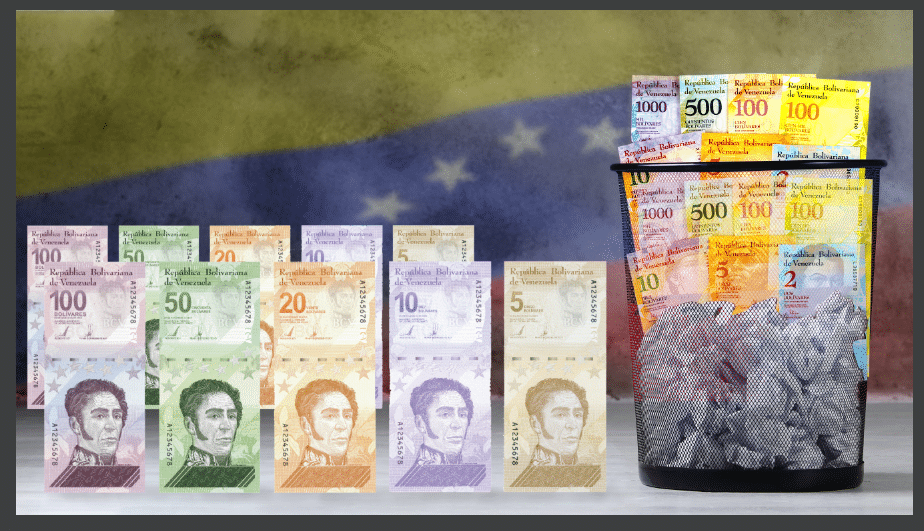 Papelera con bolívares viejos, nuevo cono monetario y bandera Venezuela.