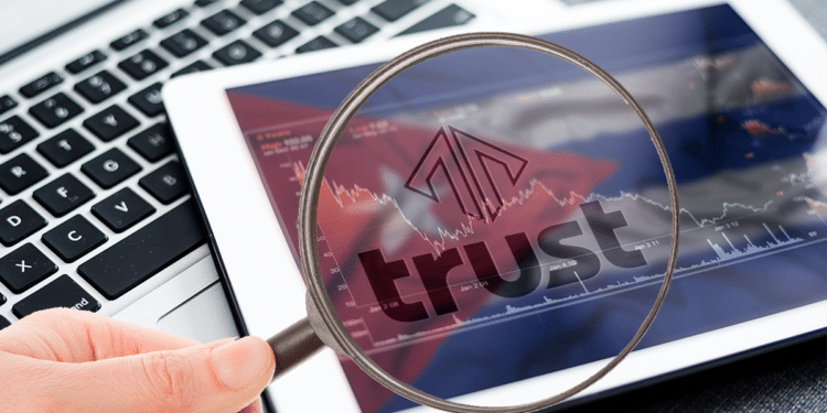 Tablet con bandera de Cuba, logo de Trust Investing y lupa.
