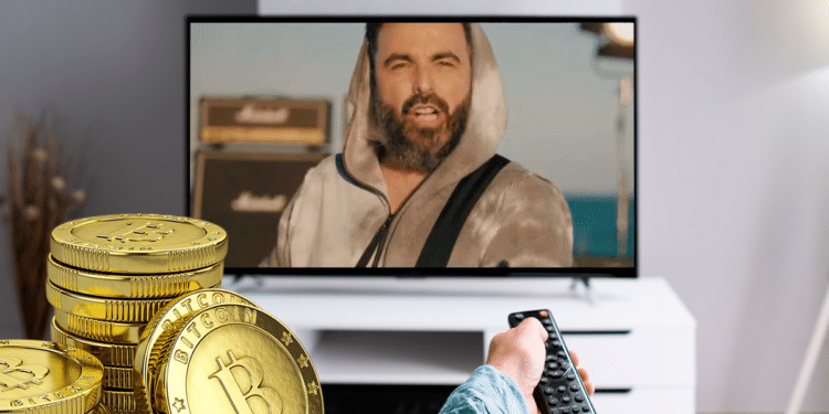 Cantautor español financia enteramente su videoclip musical con bitcoin. Composición por CriptoNoticias.  Andrey Popov / stock.adobe.