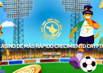 Tres jugadores de fútbol en un estadio