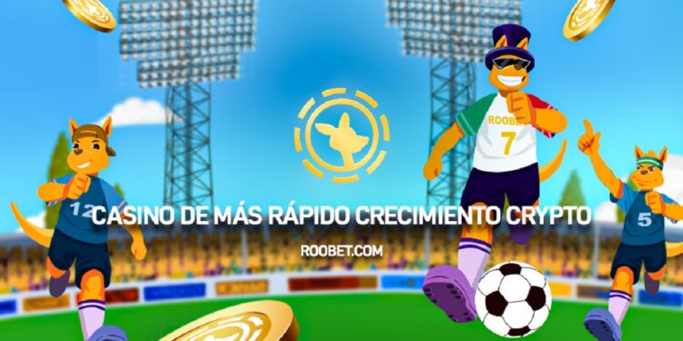 Tres jugadores de fútbol en un estadio