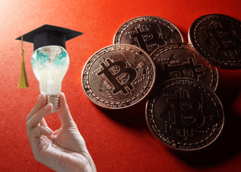 Bitcoin con fondo rojo y mano sosteniendo lamparita con