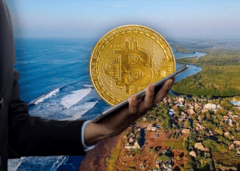 Playa de Guatemala y ejecutivo con Bitcoin.