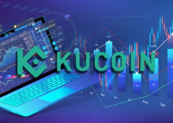 Logo del exchange Kucoin frente a una lapto con gráficos de precios.