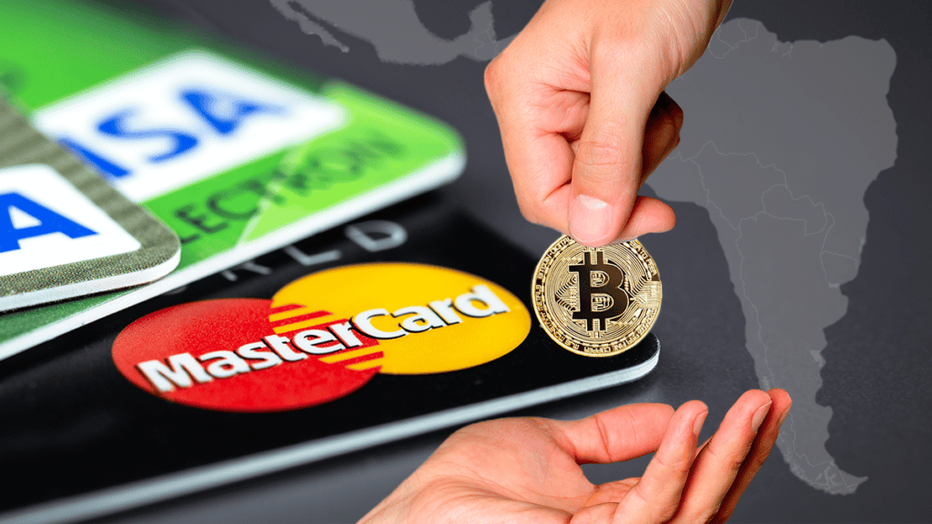 Manos intercambiando un bitcoin, acompañados de unas tarjetas mastercard y un mapa de América Latina de fondo.