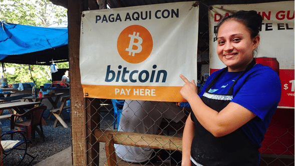 Cartel que dice "Paga aquí con Bitcoin".