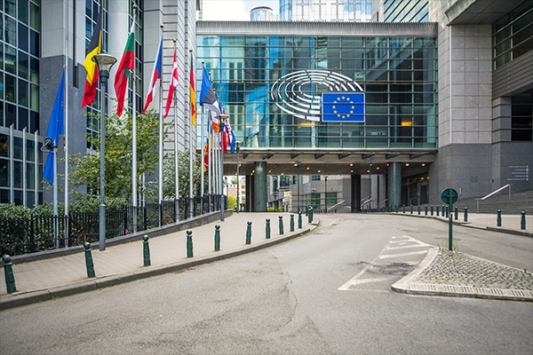 European Parliament offices with European flags in Brussels, Belgium