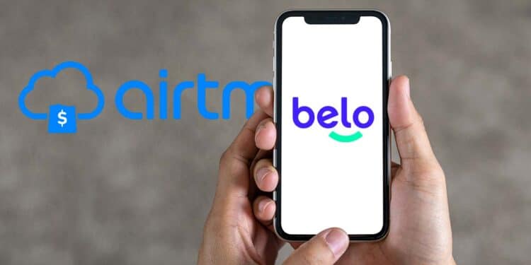 Celular usando la app de Belo con el logo de airtm de fondo.