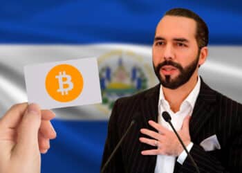 Bukele junto a un bono de Bitcoin acompañados de la bandera de El Salvador.
