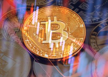 moneda de bitcoin sobre otras criptomonedas con gráfico de precio en caída