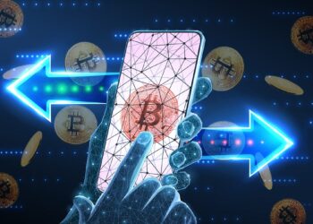 mano digital enviando bitcoins desde teléfono en red digital
