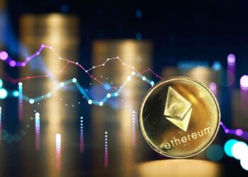 moneda de ethereum con gráfico deflacionario y monedas apiladas en el fondo