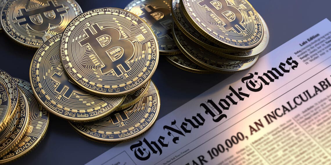 Bitcoins junto a diario de New York Times.