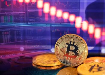 moneda de bitcoin con gráfico de precio y analista estudiando gráficos de mercado en el fondo