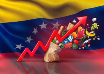 Flecha roja que representa la inflación acompañado de la bandera de Venezuela.