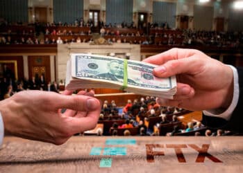 Congreso de Estados Unidos con manos sobre mesa con logo de FTX intercambiando dinero