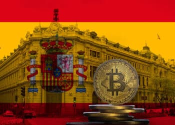 Bitcoin junto a bandera y banco de España.