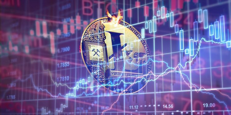 moneda de litecoin entre gráfico alcista en azul y grafico bajista en rojo en el fondo