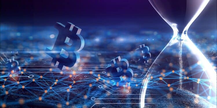 bitcoins esperando en red junto a reloj de arena detenido