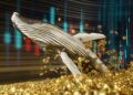ballena entre monedas y grafico