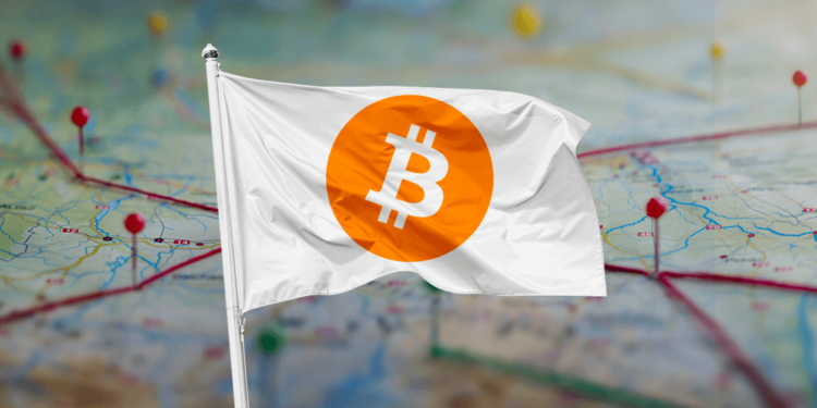 Bandera de bitcoin junto a ciudadelas.