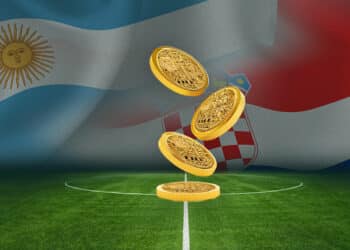 Fan token de Argetnina y Croacia con banderas al fondo en campo de fútbol