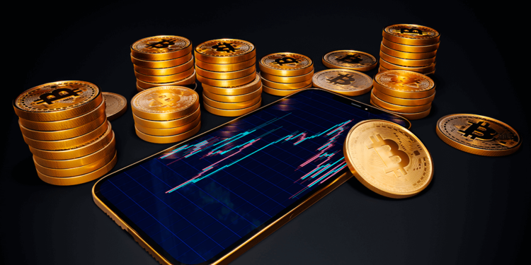 Celular con gráfico de trading junto a bitcoins.