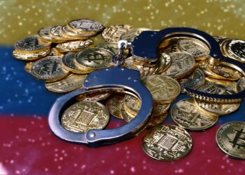 esposas sobre monedas de bitcoin y otras criptomonedas con bandera de Colombia reflejada sobre superficie brillante