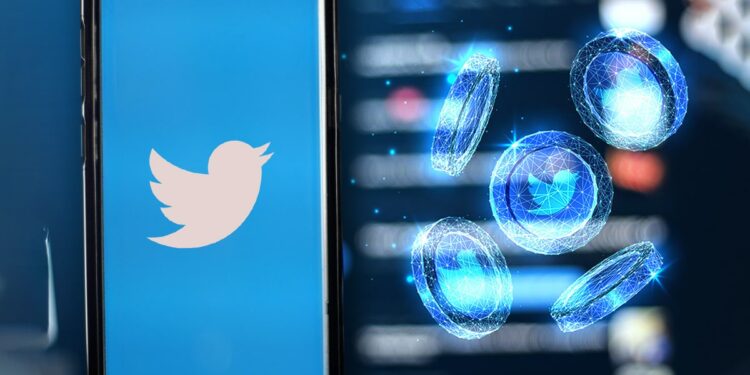 monedas digitales con logo de twitter junto teléfono con la aplicación de twitter
