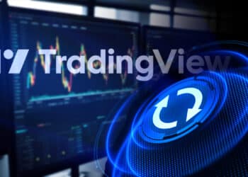 logo de Tradingview sobre pantallas con plataformas de trading en el fondo y botón de actualización superpuesto