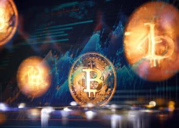 monedas de bitcoin en movimiento con grafico ascendente