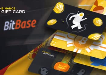 tarjetas de regalo de Binance (binance giftcard) con bandera de españa y local de bitbase en el fondo