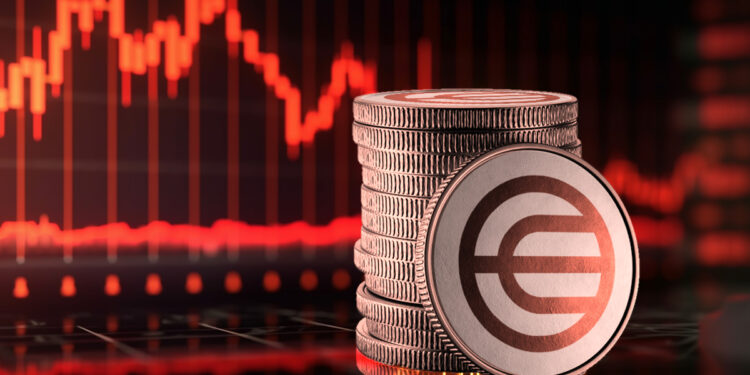 moneda de worldcoin apoyada en monedas apiladas con grafico de precio en rojo al fondo