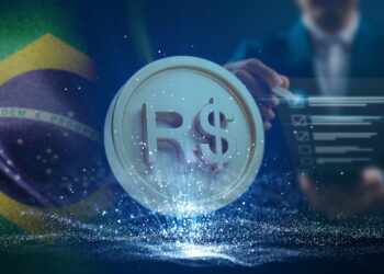 moneda de Real digital sobre plataforma digital con bandera de brasil y evaluador en el fondo